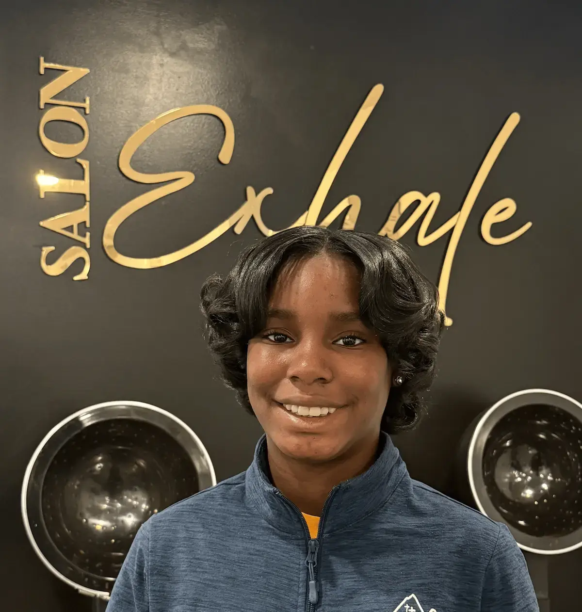 Client after a scalp detox treatment at Salon Exhale with refreshed scalp and defined curls